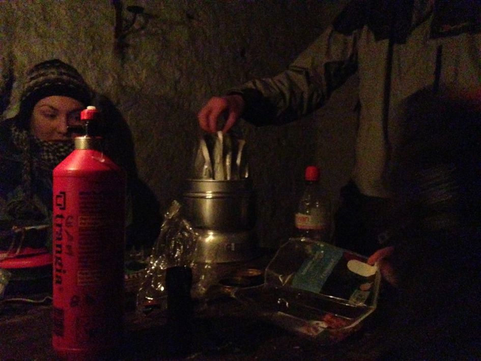 Cooking dinner in the Glas Allt Sheil bothy at Loch Muick