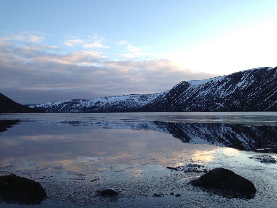 The water reflecting like glass early in morning